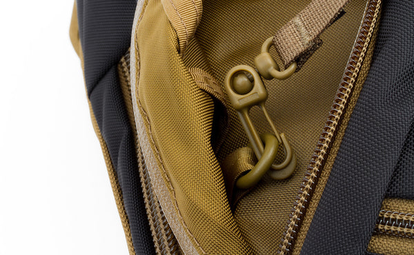 A close shot of the included Coyote (brown) key strap clipped to an o-ring.